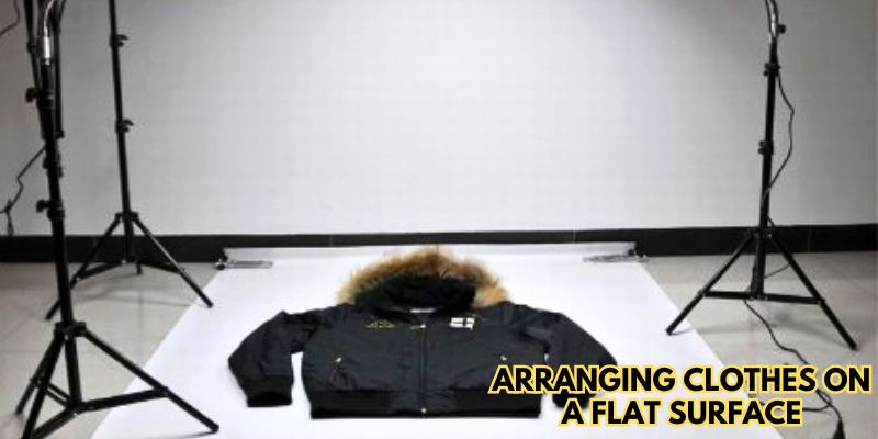 Arranging clothes on a flat surface